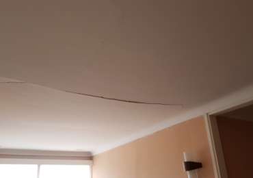Cracked and sagging ceiling before