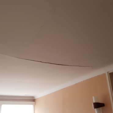 Cracked and sagging ceiling before