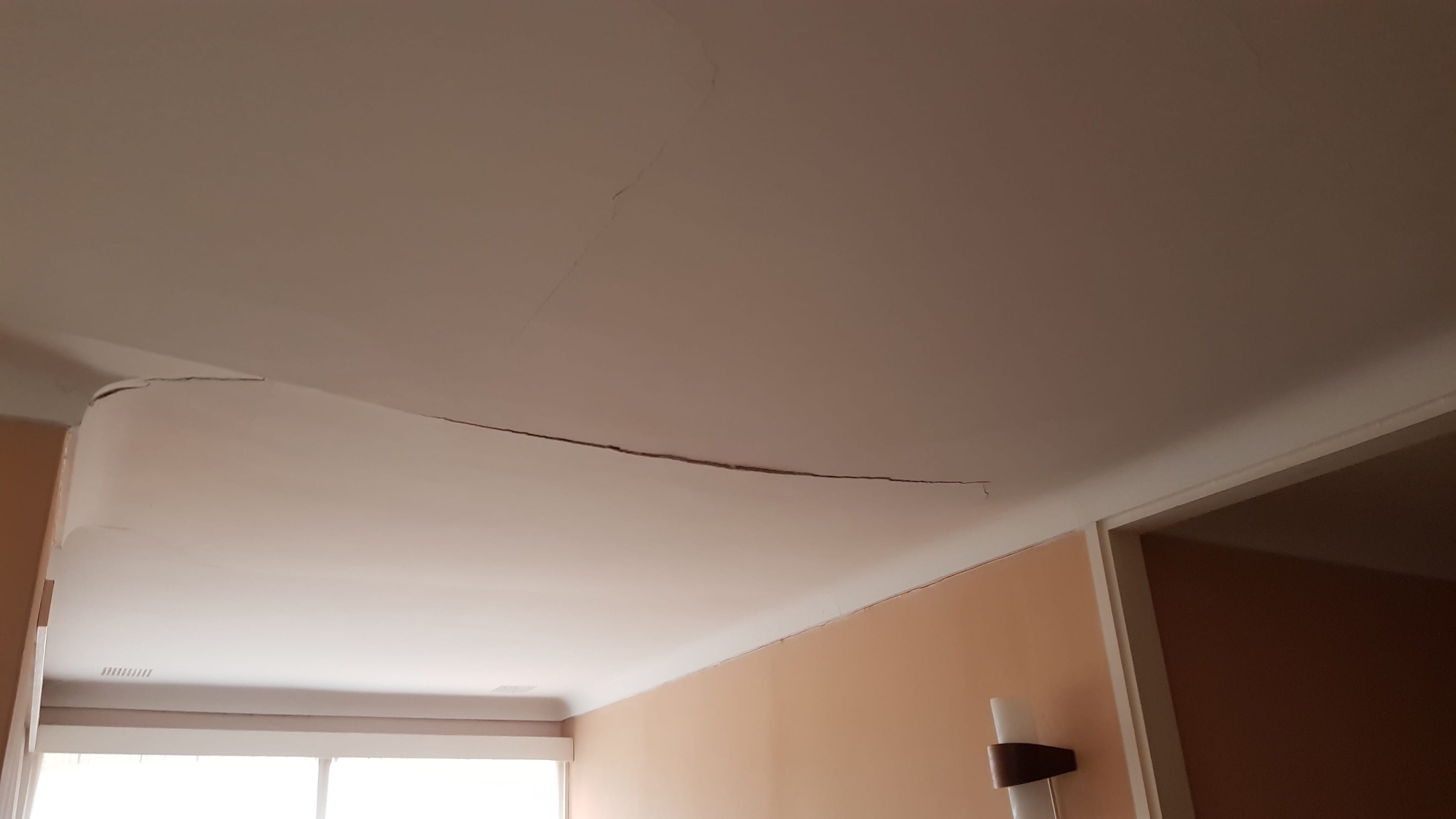 Cracked And Sagging Ceiling Before West Coast Ceiling Repairs