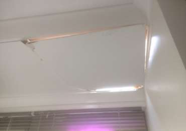 Damaged hole in ceiling before